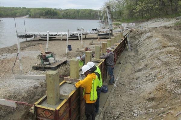 people building retaining wall at Lake George